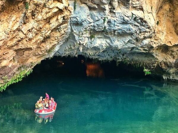 Explore Sarıhacılar village and Altınbeşik Cave with a guided tour from Alanya, including lunch and a scenic boat ride through the underground lake.